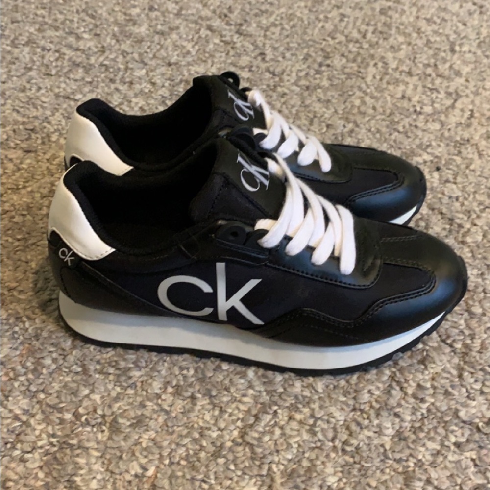 Calvin Klein 5 1/2 tennis shoes. Only worn once! In Excellent condition!